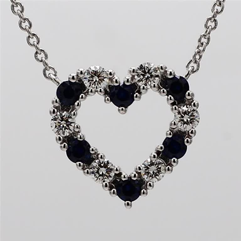 Natural Blue Round Sapphire and White Diamond .53 Carat TW White Gold Pendant